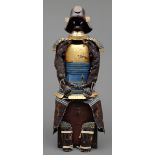 A Japanese gilded suit-of-armour (yoroi) with indigo cords (kon’ito kin’urushinuri nimaid? gusoku).