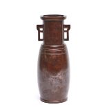 A tall Japanese shining dark red-brown bronze vase