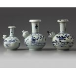 A group of three blue and white Arita kendi's