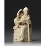 A Japanese ivory okimono of a man seated man