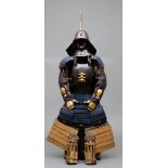 A Japanese black lacquered suit-of-armour (yoroi) with indigo-blue cords