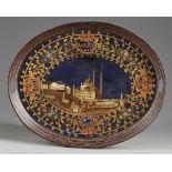 An Islamic painted metal oval shaped tray