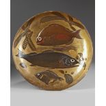 A large Japanese gilt and lacquer relief 'fish' charger