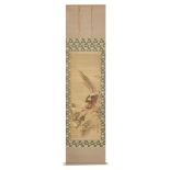 A Japanese hanging scroll with a polychrome painting of a pheasant