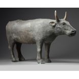 A rare Chinese painted pottery figure of an ox