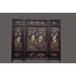 A Japanese wooden folding screen with ivory inlay