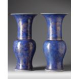 A pair of Chinese powder blue-ground gilt-decorated phoenix tail vases