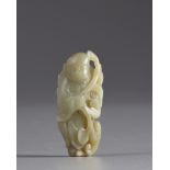 A Chinese pale celadon jade 'boy and lingzhi' carving