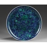 A Chinese blue ground green-enamelled 'dragon' charger