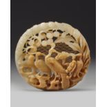 A Chinese white and russet jade 'birds' openwork carving