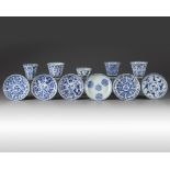 A group of eleven Chinese blue and white cups and saucers