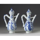 A pair of Chinese blue and white moulded ewers and two covers
