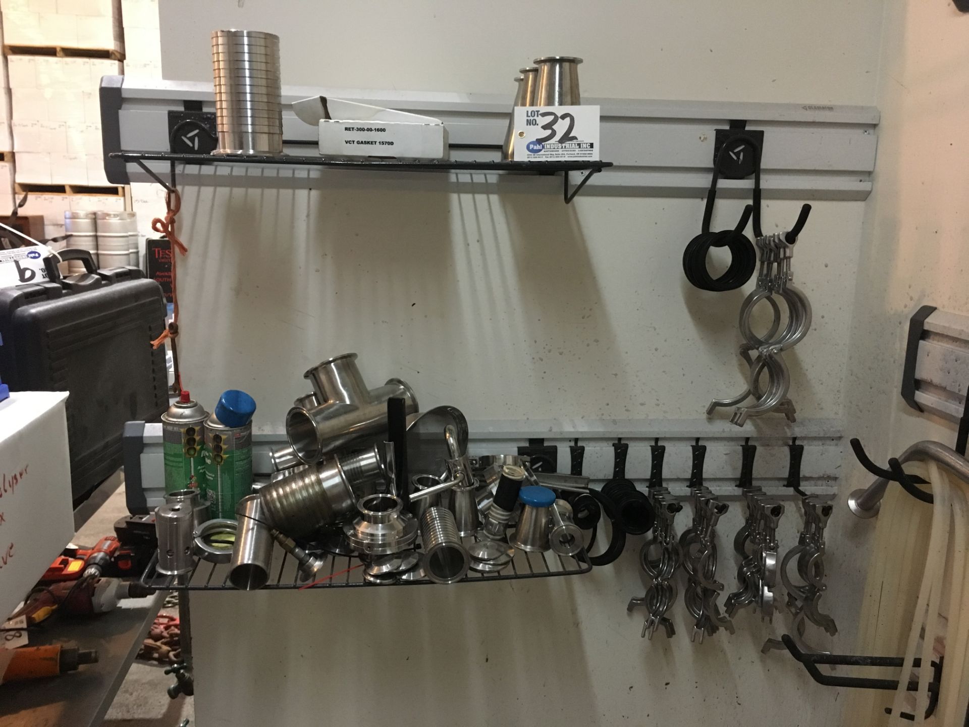 Assorted Stainless Steel Fittings, clamps, nozzles in corner racking