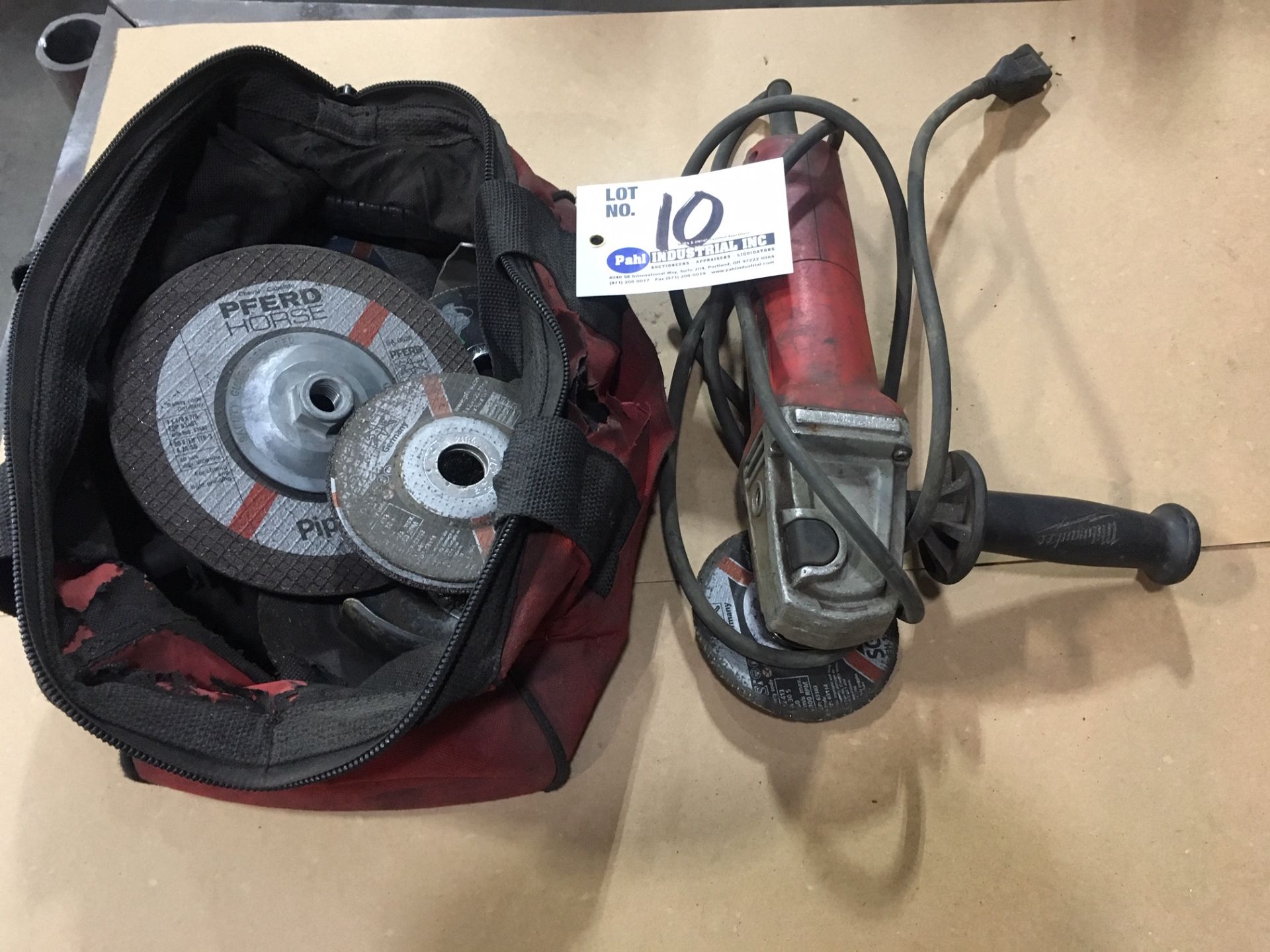 Milwaukie 4 1/2" angle grinder c/w bag and assorted discs