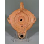 ROMAN TERRACOTTA OIL LAMP WITH HANDLES