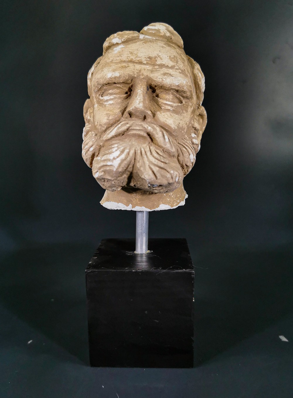 GANDHARA STUCCO HEAD OF A BEARDED MAN