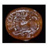 SASSANIAN CARNELIAN STONE SEAL BEAD WITH STAG AND SCRIPT