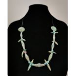 BRONZE AGE BEADED NECKLACE WITH WOLF TEETH