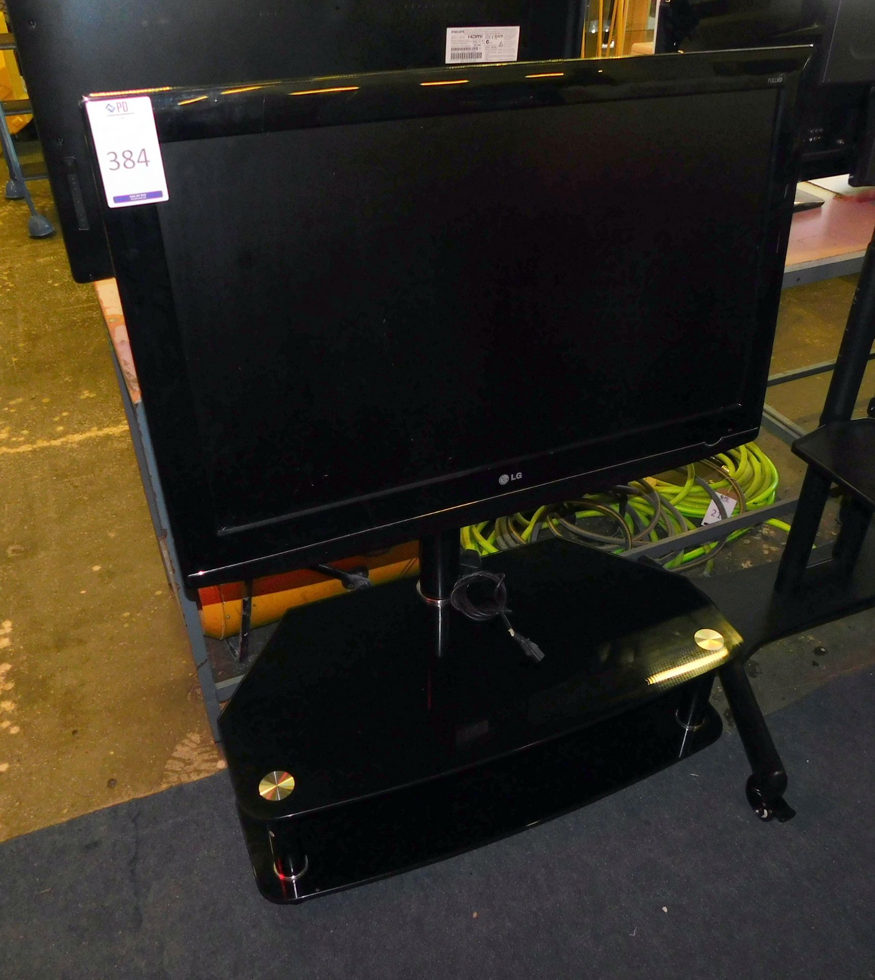 LG Television on Glass Stand (Located Stockport – See General Notes for Full Address)