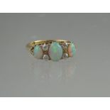 VICTORIAN 18CT GOLD THREE TONE OPAL RING.