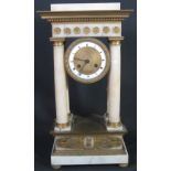 FRENCH 19TH CENTURY GILT METAL AND ALABASTER TWO TRAIN PORTICO CLOCK in Romanesque style having