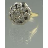 18CT GOLD DIAMOND CLUSTER RING. In domed flower design, the central brilliant cut diamond 0.