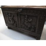 SMALL 17TH CENTURY STYLE OAK COFFER having two panelled lid with strap hinges revealing candle box