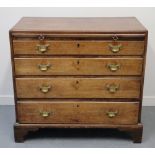 18TH CENTURY MAHOGANY STRAIGHT FRONT BACHELOR'S CHEST of four graduated and moulded drawers under a