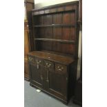 PART 18TH CENTURY OAK WELSH DRESSER having boarded two shelf rack back with iron hooks under a