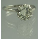 A PLATINUM AND DIAMOND SOLITAIRE RING. The claw set brilliant cut diamond an estimated 1.8cts.