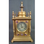 19TH CENTURY GILT BRONZE ARCHITECTURAL GOTHIC STYLE TWO TRAIN MANTEL CLOCK the case set with