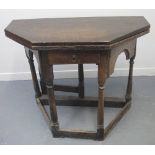 17TH CENTURY OAK OCTAGONAL FOLD OVER CREDENCE TABLE having single frieze drawer on stretcher base