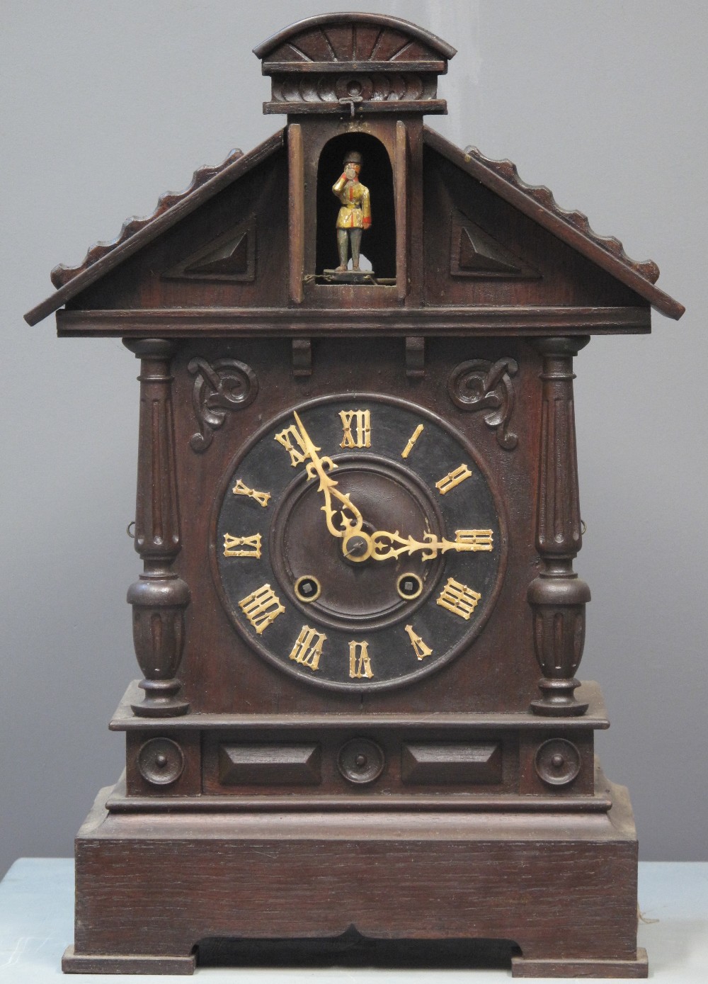 19TH CENTURY BAVARIAN STAINED ARCHITECTURAL AUTOMATON TWO TRAIN CLOCK having Roman numerals,