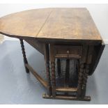 17TH CENTURY OAK OVAL DOUBLE GATE ACTION DROP LEAF DINING TABLE, moulded drawers to both ends,