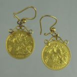 A PAIR OF HALF SOVEREIGN EARRINGS.
