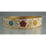 UNMARKED YELLOW GOLD BANGLE decorated in red, yellow ,