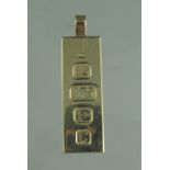 9CT GOLD RECTANGULAR INGOT PENDANT. Hallmarks for Birmingham 1977. 42 x 14mm approx, weight 31.