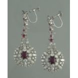 A PAIR OF RUBY AND DIAMOND DROP EARRINGS. Length of drop 5.5cm approx. Weight 18.1g approx. (B.P.