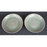 PAIR OF THAI CELADON GLAZED SI SATCHANALAI SAWANKHALOK GLAZED STONEWARE DISHES with incised