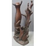 BLACK FOREST STYLE STICK STAND in the form of a seated fox with stylized trunk and twigs on a