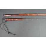 19TH CENTURY BAMBOO SWORD STICK having leather wrist thong, brass collar and feral.