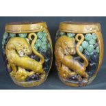 PAIR OF CHINESE STYLE PIERCED SANCAI GLAZED BARREL SHAPED POTTERY GARDEN SEATS with Lion Dog and