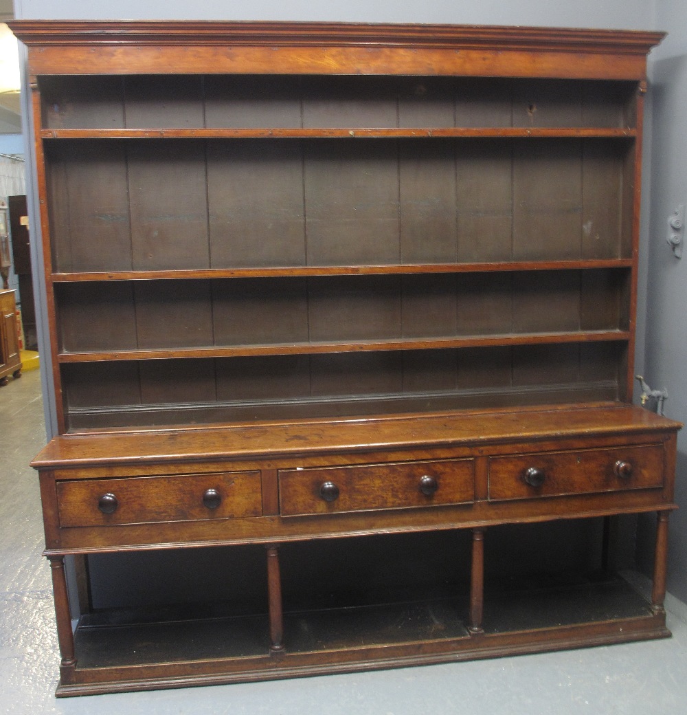 19TH CENTURY WELSH OAK POTBOARD DRESSER having boarded three shelf rackback with moulded cornice,