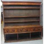 19TH CENTURY WELSH OAK POTBOARD DRESSER having boarded three shelf rackback with moulded cornice,