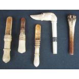 FOUR ANTIQUE TURNED IVORY BONE APPLE CORERS, one with claw handle,