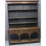 19TH CENTURY OAK RACK BACK POTBOARD DRESSER having moulded cornice with three fitted shelves above