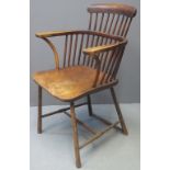 LATE 19TH CENTURY ELM AND BEECH STICK BACKED FIRESIDE ELBOW CHAIR with curved top rail,