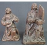 TWO SIMILAR CARVED OAK MUSICIAN FIGURES in Medieval style,