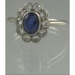 OVAL SAPPHIRE AND DIAMOND RING. The oval sapphire approx 7 x 6mm.