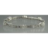 DIAMOND LINK BRACELET OF BAGUETTE AND MARQUISE DIAMONDS in graduated sizes.